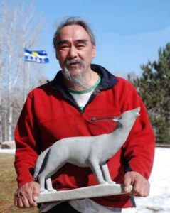 Joseph-Illupalik-Paluq-carves-serpentine-marble-walrus-tusk-and-whalebone-at-his-studio-near-Lake-Clear-kathy-haycock